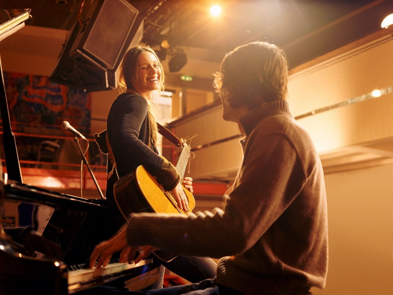 Musicians playing guitar and piano